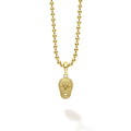 18K gold superfine Caviar beading form this skull amulet. Finished on a 18K gold ball chain necklace.