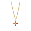 18K gold & orange pear mixed cut diamonds surround a round brilliant cut diamond.