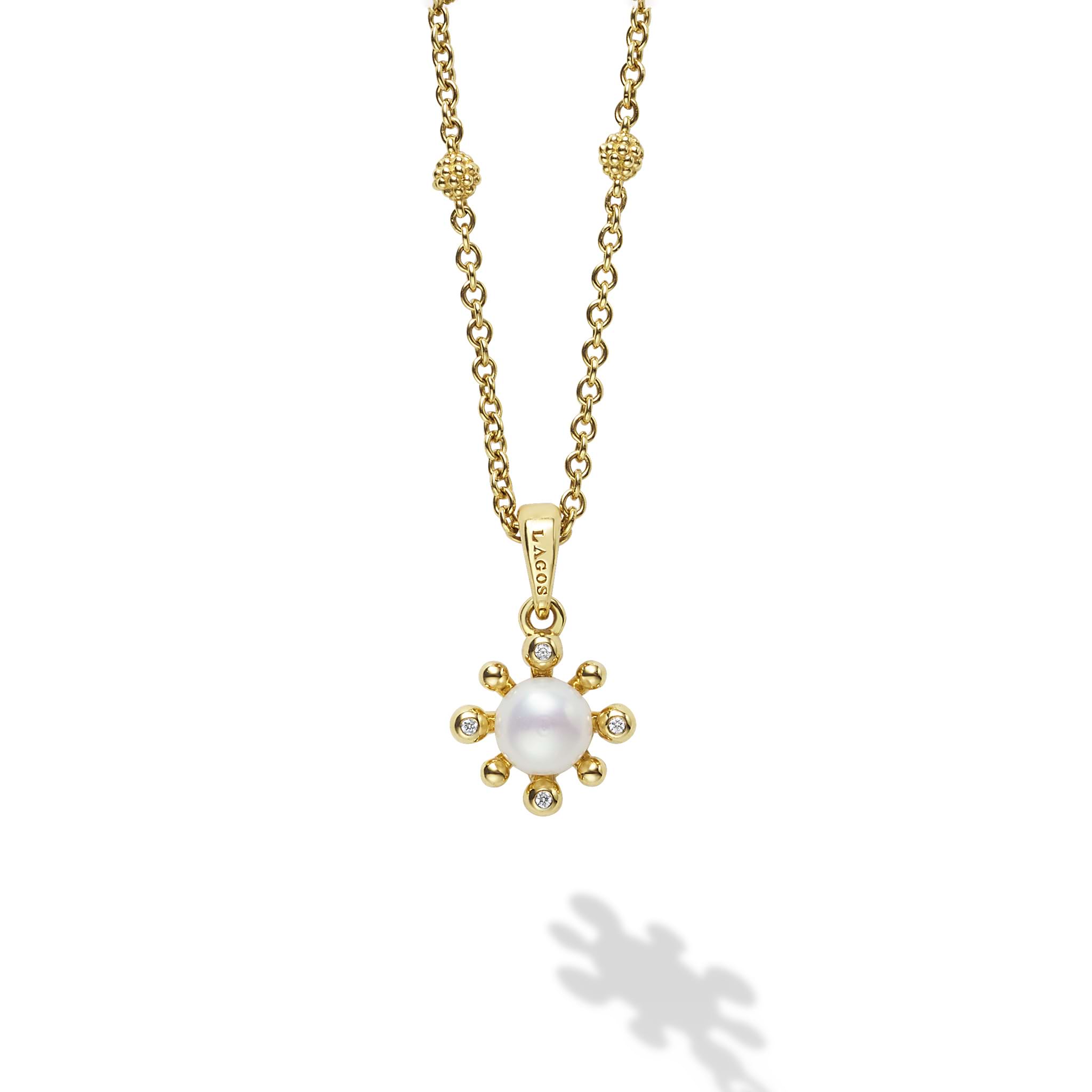 A cultured freshwater pearl framed by diamond fleurs finished on an 18K gold chain detailed with Caviar spheres. Necklace adjusts from 16 to 18 inches. LAGOS diamonds are the highest quality natural stones.