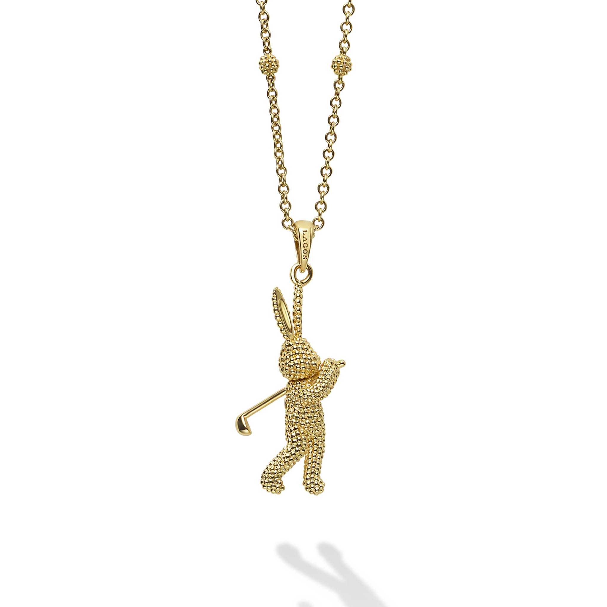 Artfully crafted 18K gold Caviar beaded rabbit pendant playing golf. Accommodates most LAGOS chains.