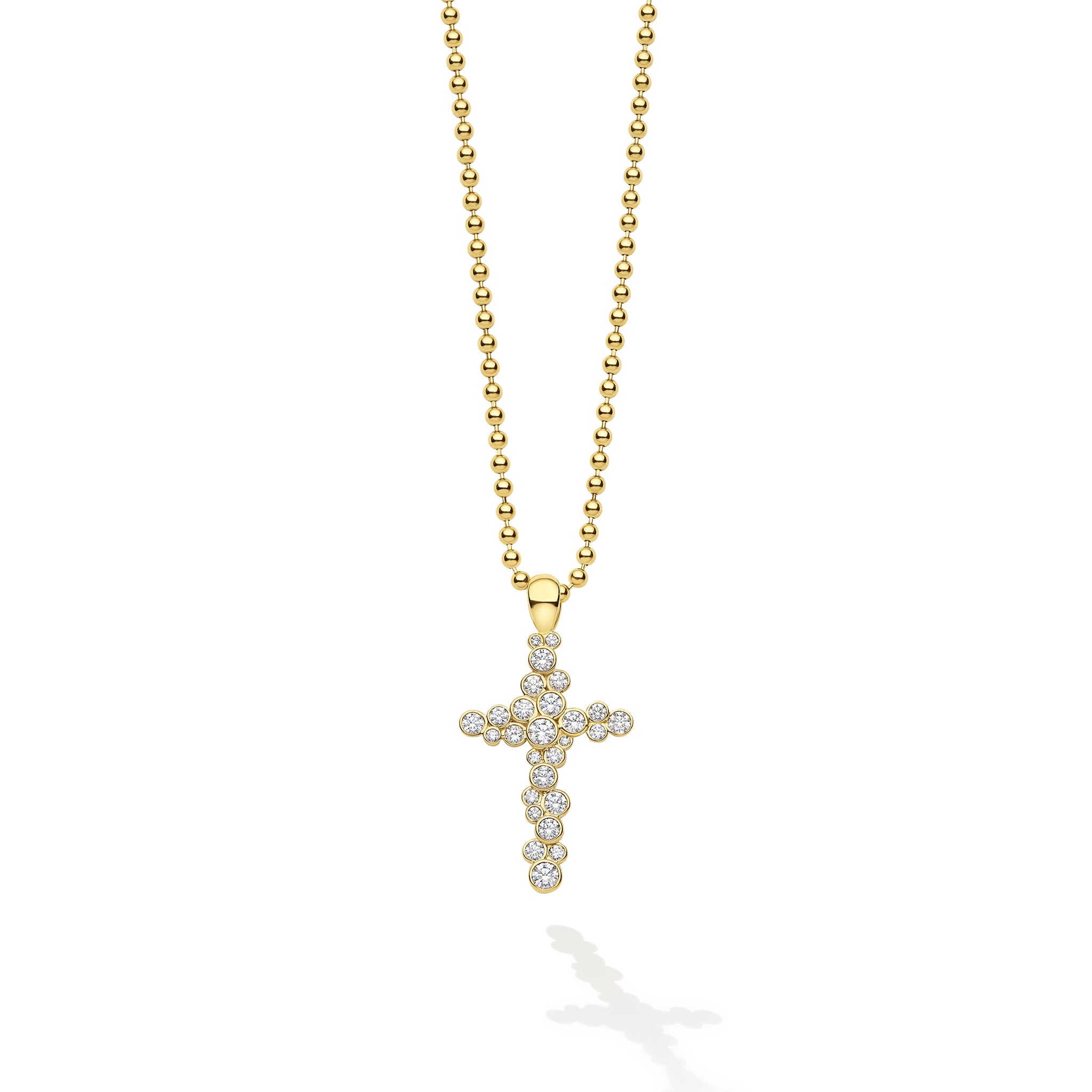 Gold cross pendant necklace on a white background