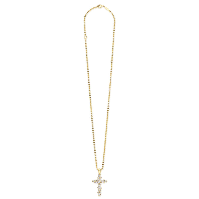 Gold necklace with a cross pendant on a white background