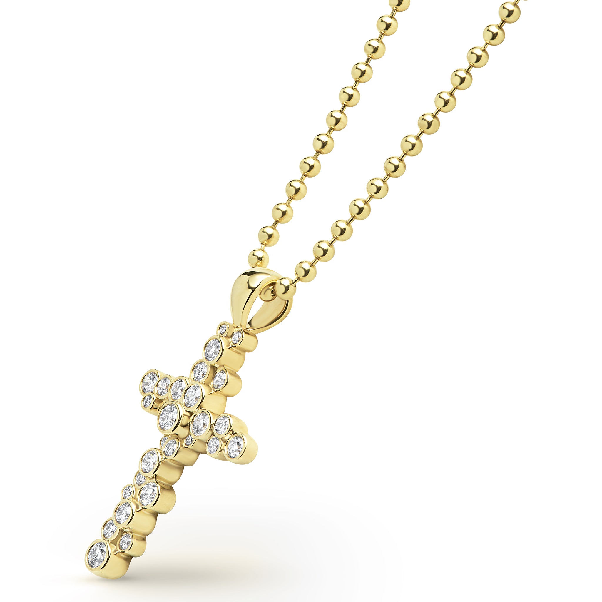 Gold cross pendant necklace with clear stones on a white background