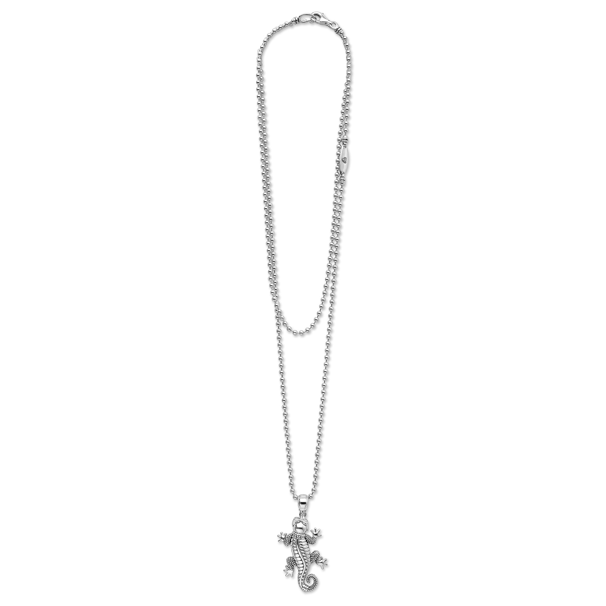 Silver necklace with a gecko pendant on a white background