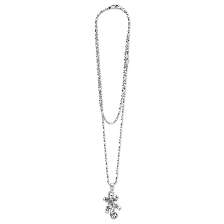 Silver necklace with a gecko pendant on a white background