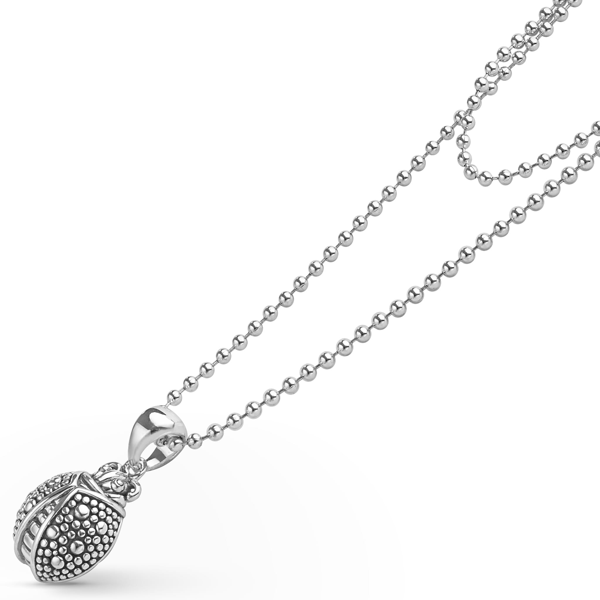 Sterling silver necklace featuring a charming ladybug pendant with LAGOS Caviar beading, strung on a ball-chain for elegance and whimsy.