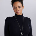 Woman wearing Signature Caviar Sterling Silver Anchor Pendant Necklace featuring a detailed anchor with Caviar beading on a polished ball chain, reflecting refined craftsmanship.