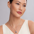 Woman wearing Rare Wonders Lapis Beetle Diamond Pendant Necklace with a blue beetle, gold accents, and sterling silver Caviar beaded stations on a silver chain.