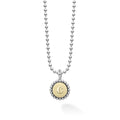 Signature Caviar C Initial Charm Necklace featuring a sterling silver ball chain and an 18K gold disc with a “C” initial, showcasing LAGOS' elegant craftsmanship.
