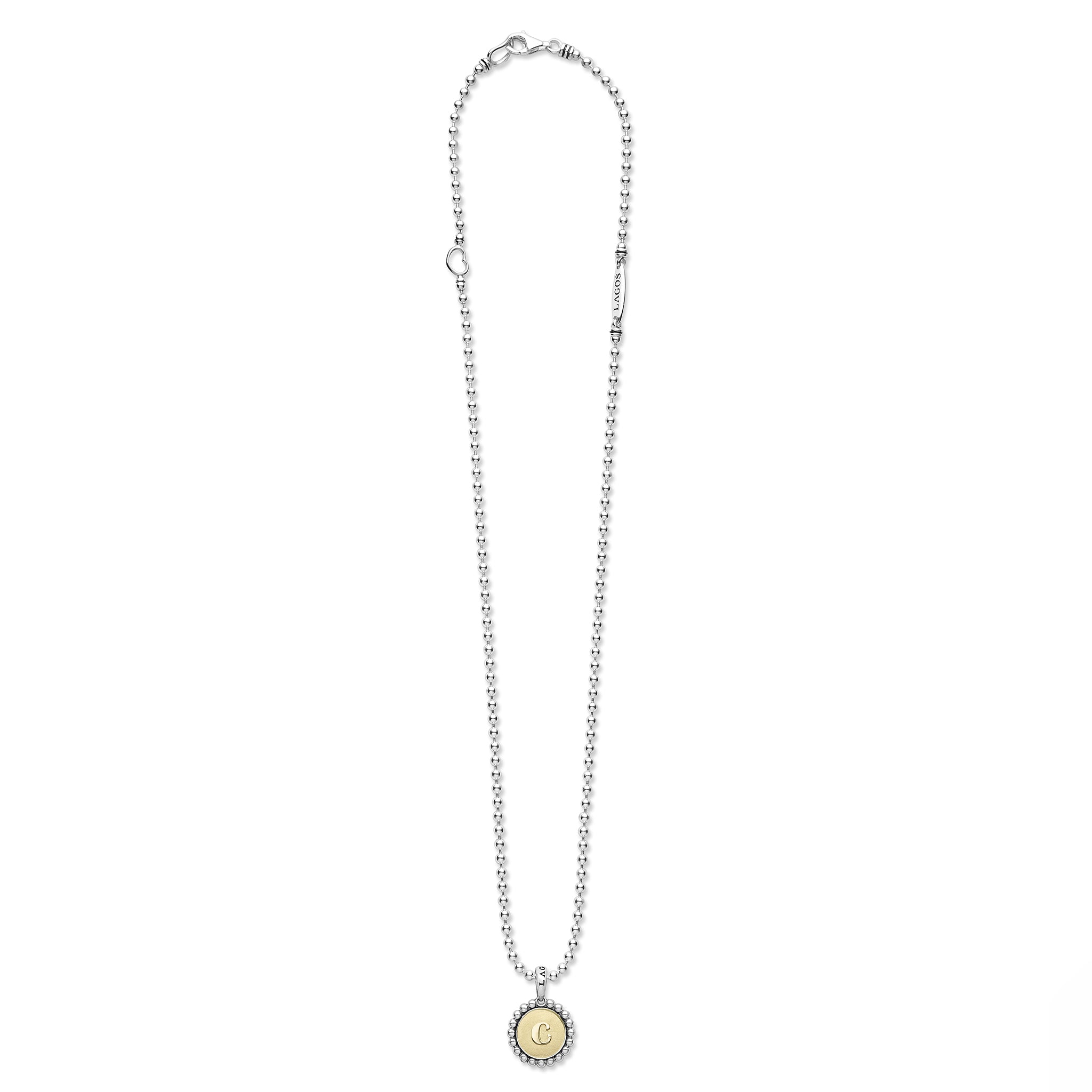 Signature Caviar C Initial Charm Necklace featuring a sterling silver beaded-ball chain, 18K gold medallion with engraved C, and tubular LAGOS tag.