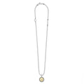 Signature Caviar C Initial Charm Necklace featuring a sterling silver beaded-ball chain, 18K gold medallion with engraved C, and tubular LAGOS tag.