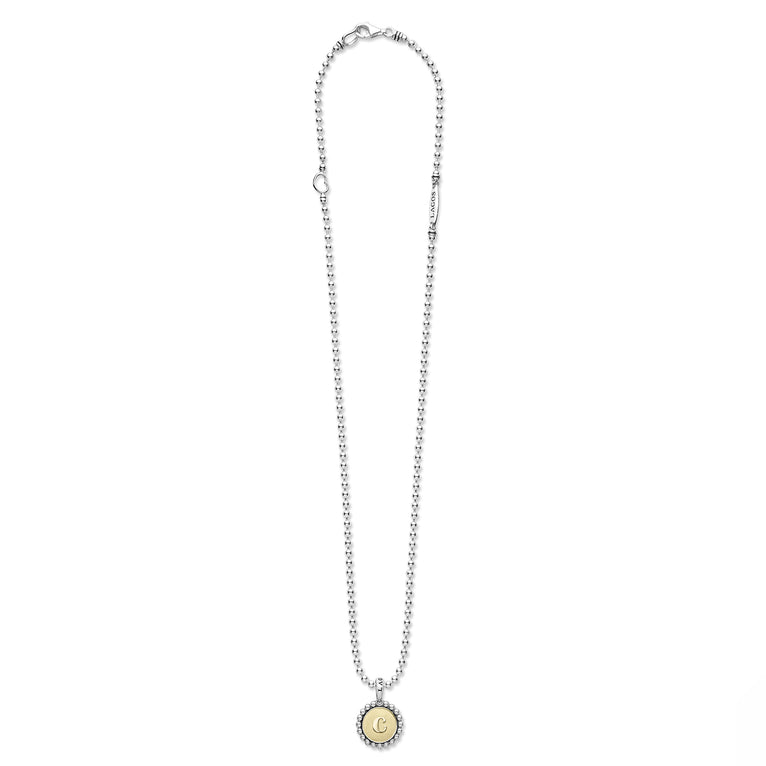 Signature Caviar C Initial Charm Necklace featuring a sterling silver beaded-ball chain, 18K gold medallion with engraved C, and tubular LAGOS tag.