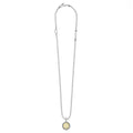 Signature Caviar D Initial Charm Necklace by LAGOS, featuring a sterling silver ball chain, 18K gold d charm, heart link, and caviar beading.