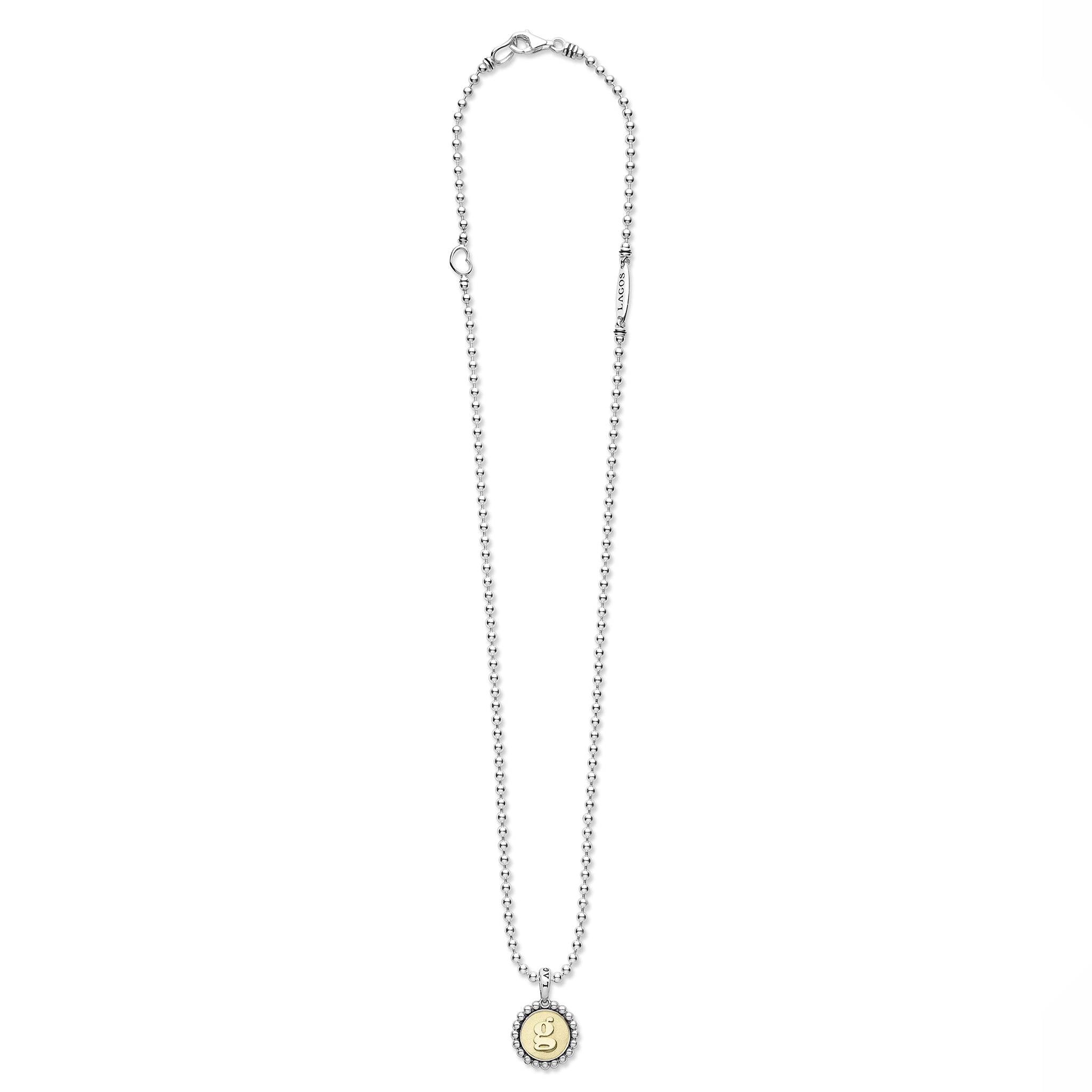 Signature Caviar G Initial Charm Necklace features sterling silver ball chain, a yellow-gold engraved g pendant, heart charm, and LAGOS bar accent.