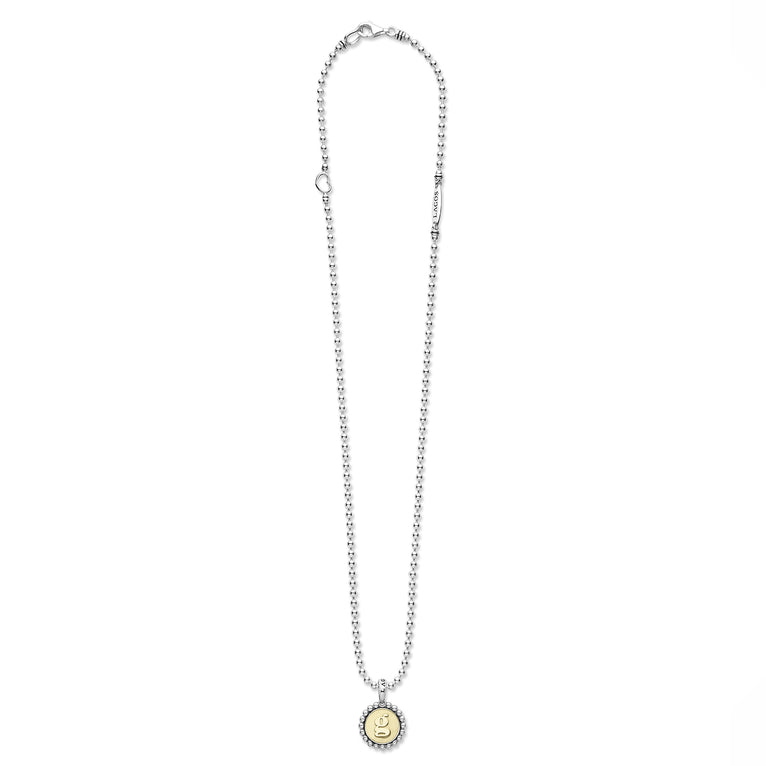 Signature Caviar G Initial Charm Necklace features sterling silver ball chain, a yellow-gold engraved g pendant, heart charm, and LAGOS bar accent.