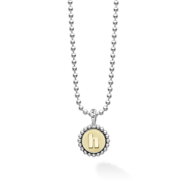 Our Signature Caviar sterling silver and 18K gold initial 'H' charm finished on a sterling silver ball chain necklace.