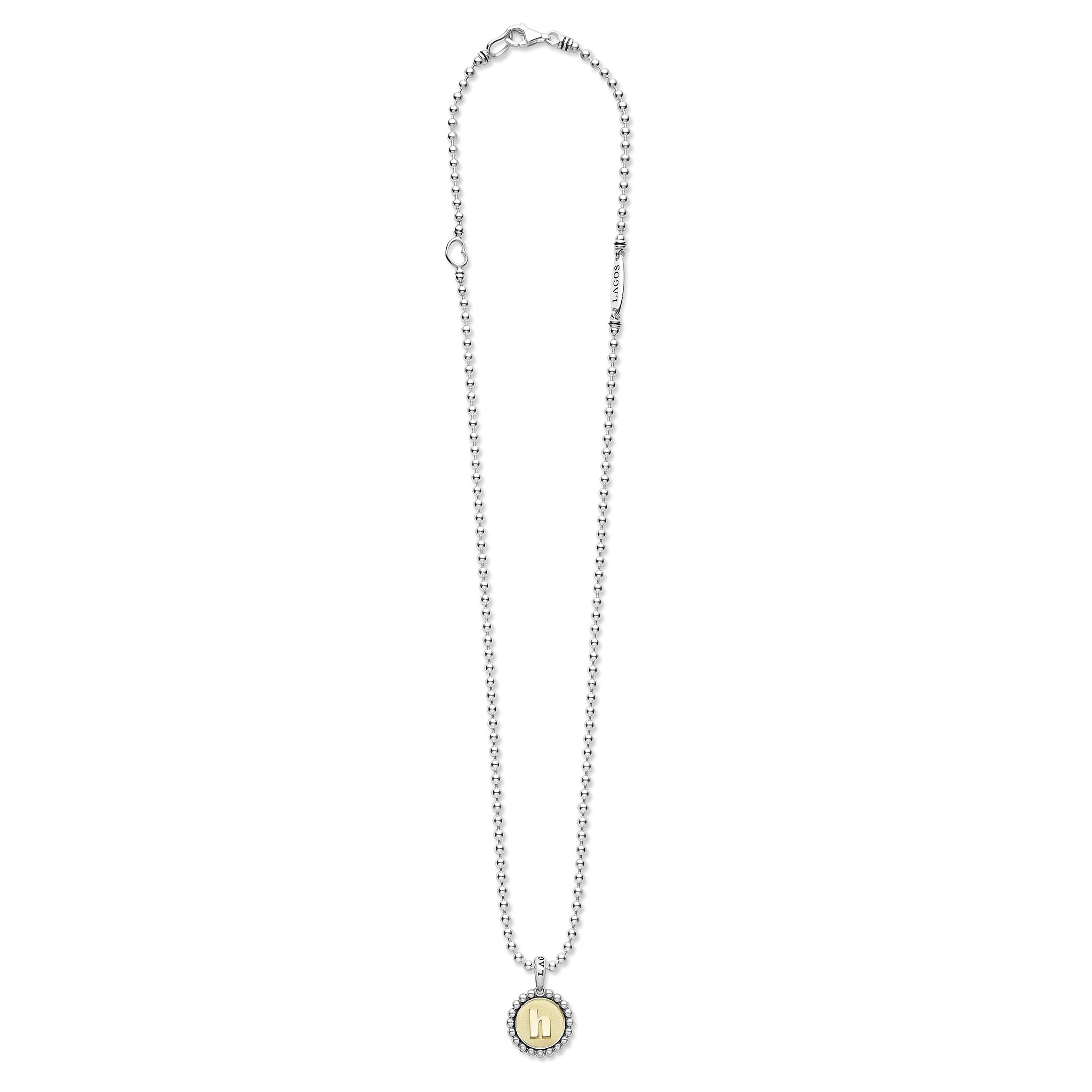Signature Caviar H Initial Charm Necklace with a sterling silver bead chain and 18K gold h pendant encased in caviar beading, showcasing LAGOS elegance.