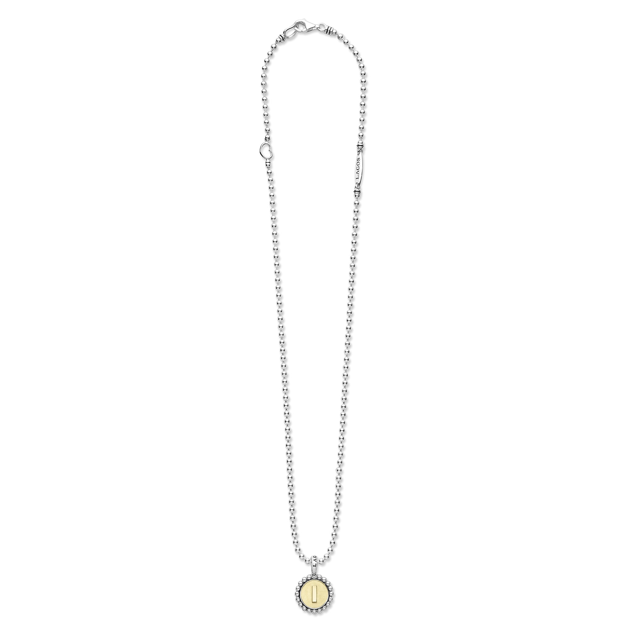 Signature Caviar L Initial Charm Necklace featuring a sterling silver ball chain, caviar beading, and a two-tone pendant with an 18K gold I initial and heart accent.