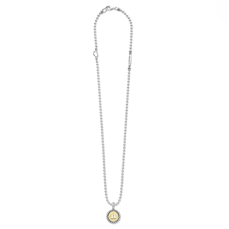 Signature Caviar N Initial Charm Necklace features a sterling silver beaded chain with an 18K gold 'N' pendant, showcasing LAGOS' refined craftsmanship and timeless elegance.