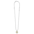 Signature Caviar Q Initial Charm Necklace with sterling silver ball chain, caviar-beaded bezel, and 18K gold disc pendant stamped with “Q.”