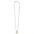 Signature Caviar R Initial Charm Necklace with sterling silver bead chain, 18K gold disc with “r” initial, and lobster-claw clasp. Elegant LAGOS craftsmanship.