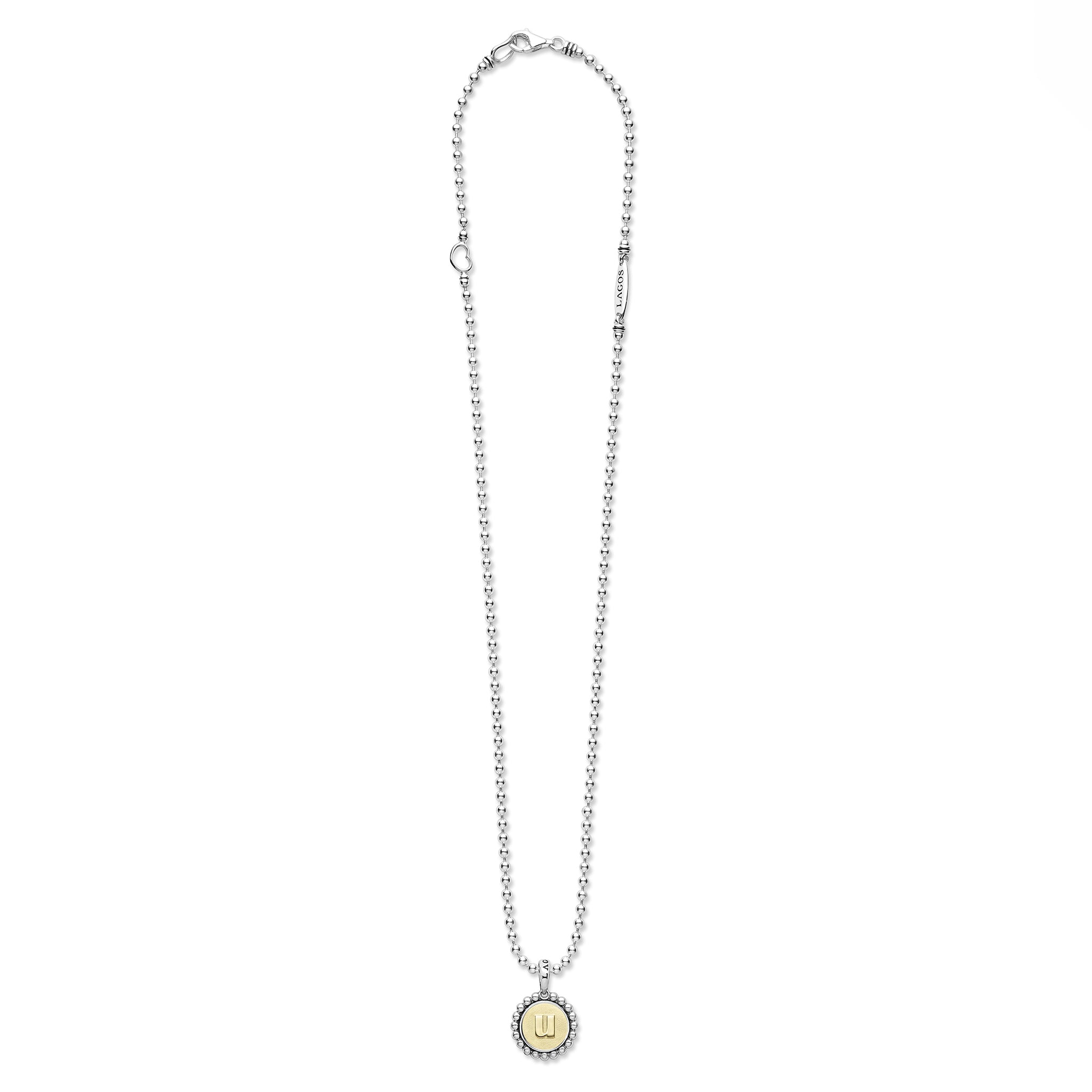 Signature Caviar U Initial Charm Necklace features sterling silver bead chain with a lobster clasp and a round pendant, showcasing an 18K gold “U” initial framed by caviar beading.
