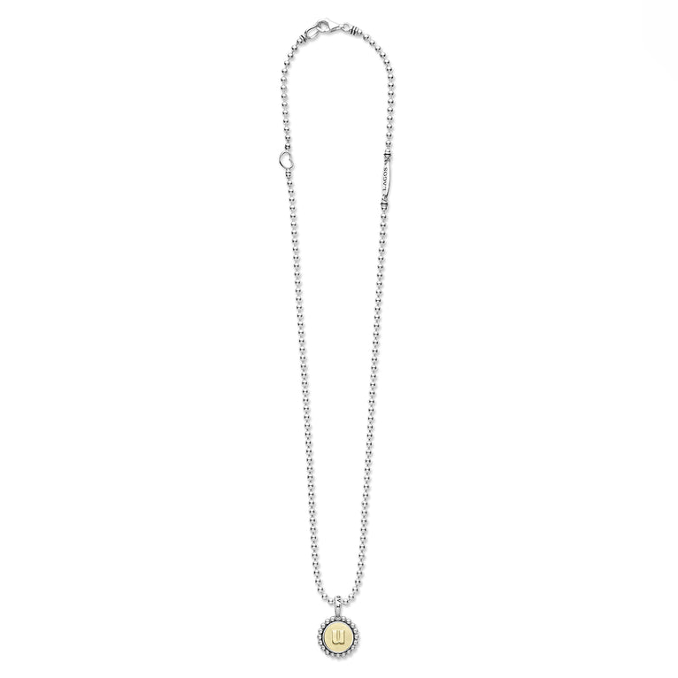 Signature Caviar U Initial Charm Necklace features sterling silver bead chain with a lobster clasp and a round pendant, showcasing an 18K gold “U” initial framed by caviar beading.