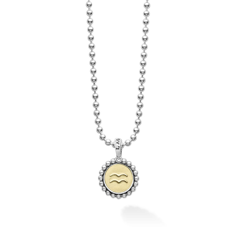 Our Signature Caviar sterling silver and 18K gold Aquarius charm finished on a sterling silver ball chain necklace. This zodiac charm represents birthdays from January 20 to February 18.