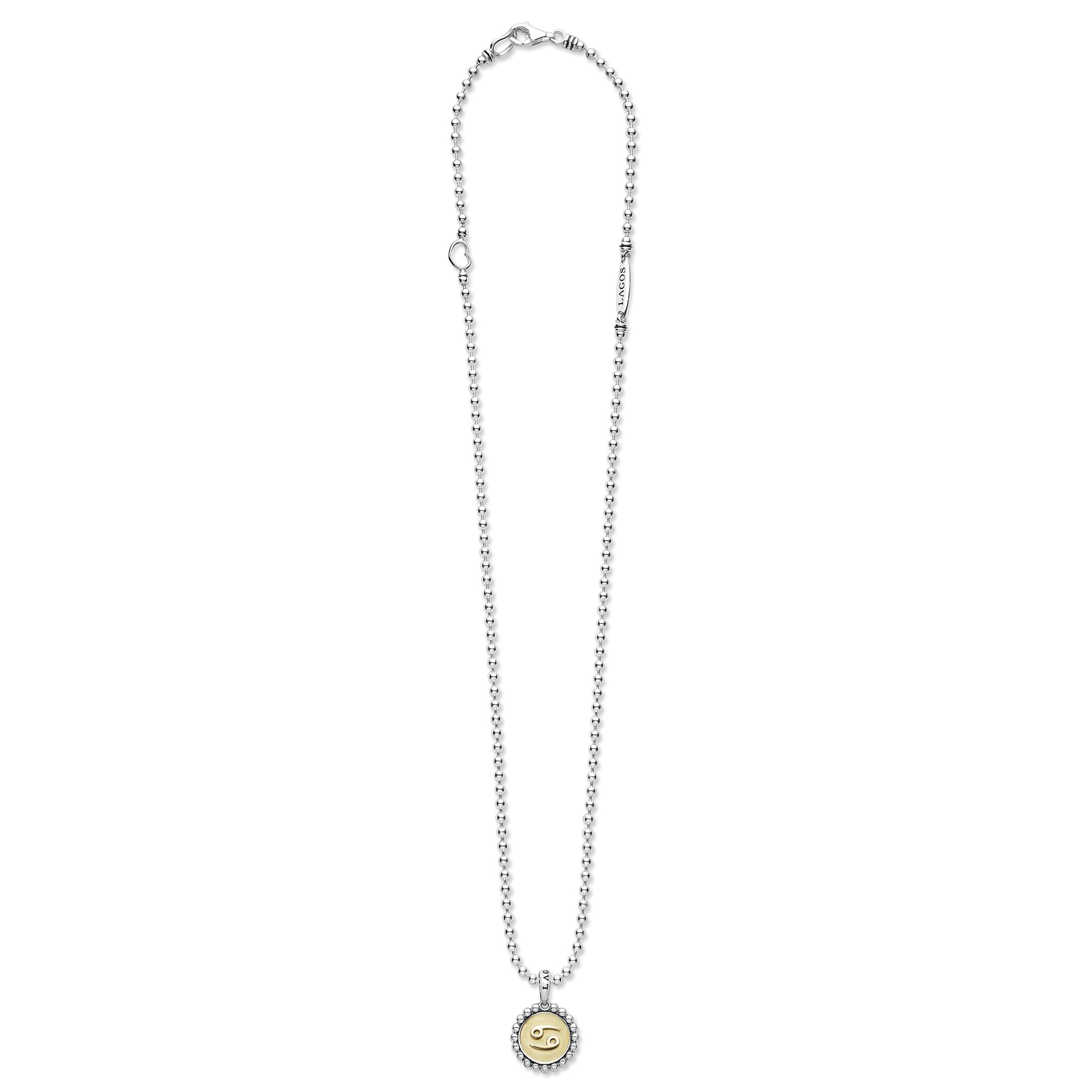 Signature Caviar Cancer Zodiac Charm Necklace with sterling silver beaded chain, 18K gold Cancer pendant, and LAGOS detail, embodying bold individuality and elegance.