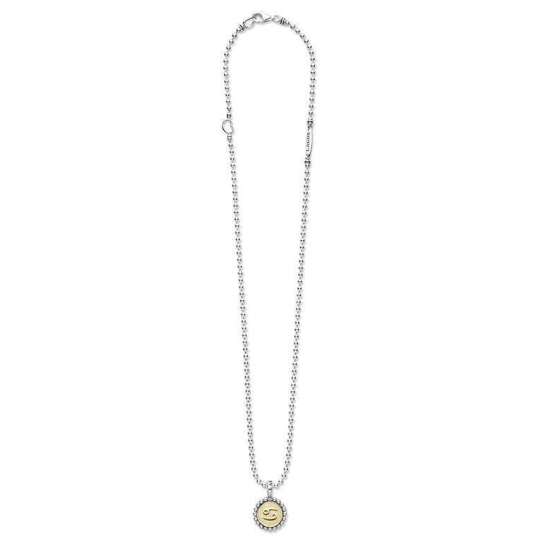 Signature Caviar Cancer Zodiac Charm Necklace with sterling silver beaded chain, 18K gold Cancer pendant, and LAGOS detail, embodying bold individuality and elegance.
