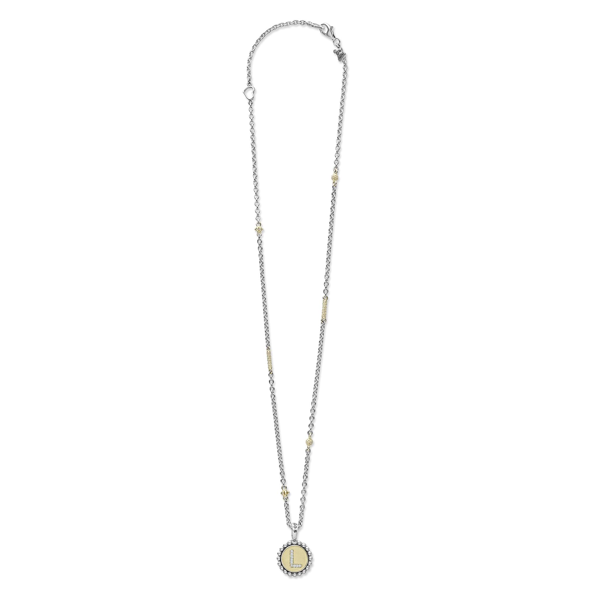 Signature Caviar L Initial Diamond Charm Necklace with sterling silver chain, 18K gold beads, and diamond-accented L pendant, reflecting modern elegance and LAGOS craftsmanship.