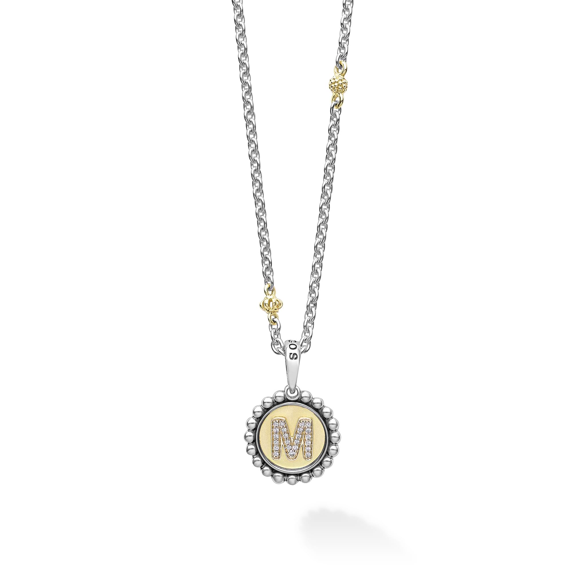 Our Signature Caviar sterling silver and 18K gold initial 'M' diamond charm finished on a sterling silver and 18K gold Caviar beaded necklace.