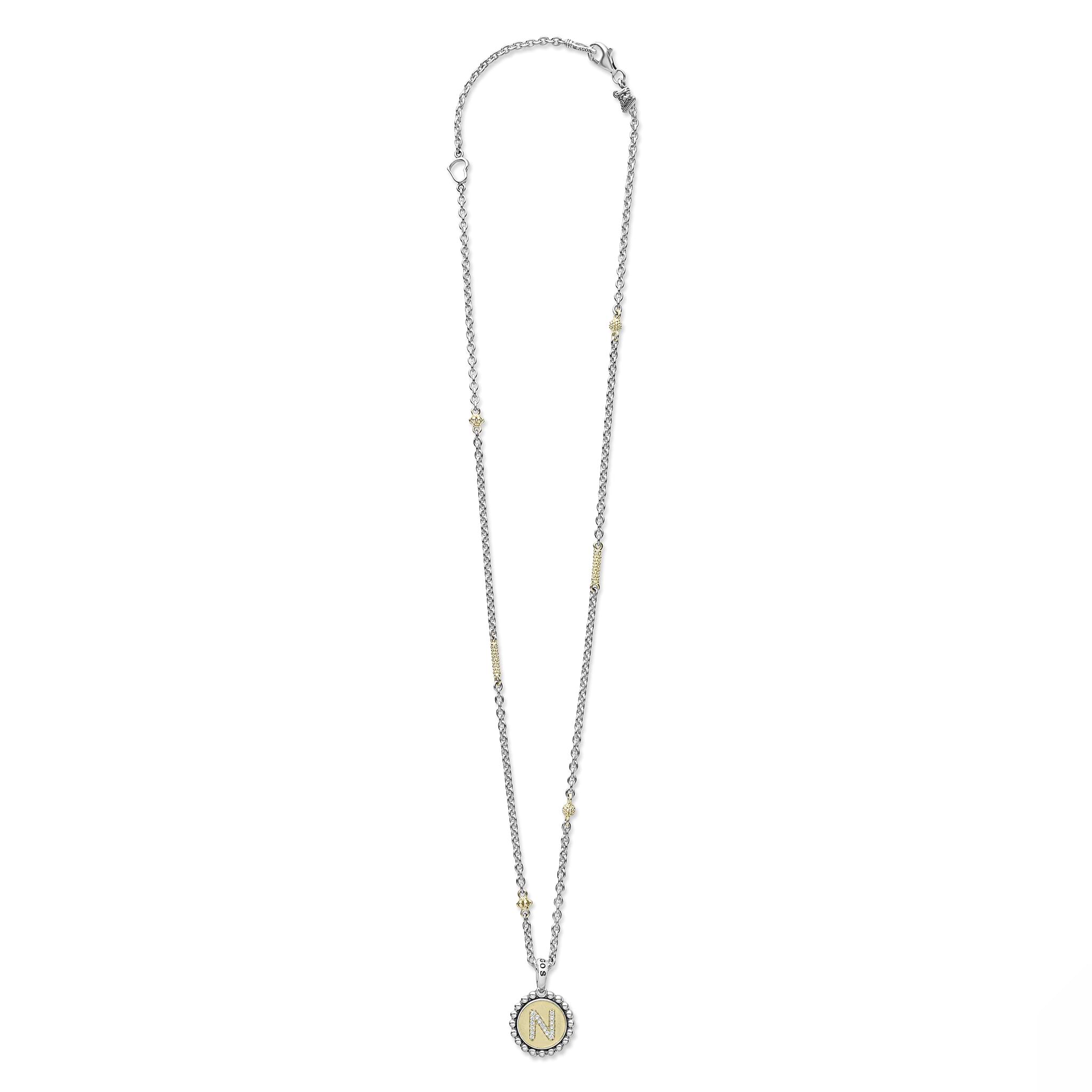 Signature Caviar N Initial Diamond Charm Necklace: A sterling silver chain with 18K gold accents, featuring a crystal-studded N pendant with caviar beading.