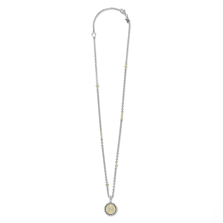 Signature Caviar N Initial Diamond Charm Necklace: A sterling silver chain with 18K gold accents, featuring a crystal-studded N pendant with caviar beading.