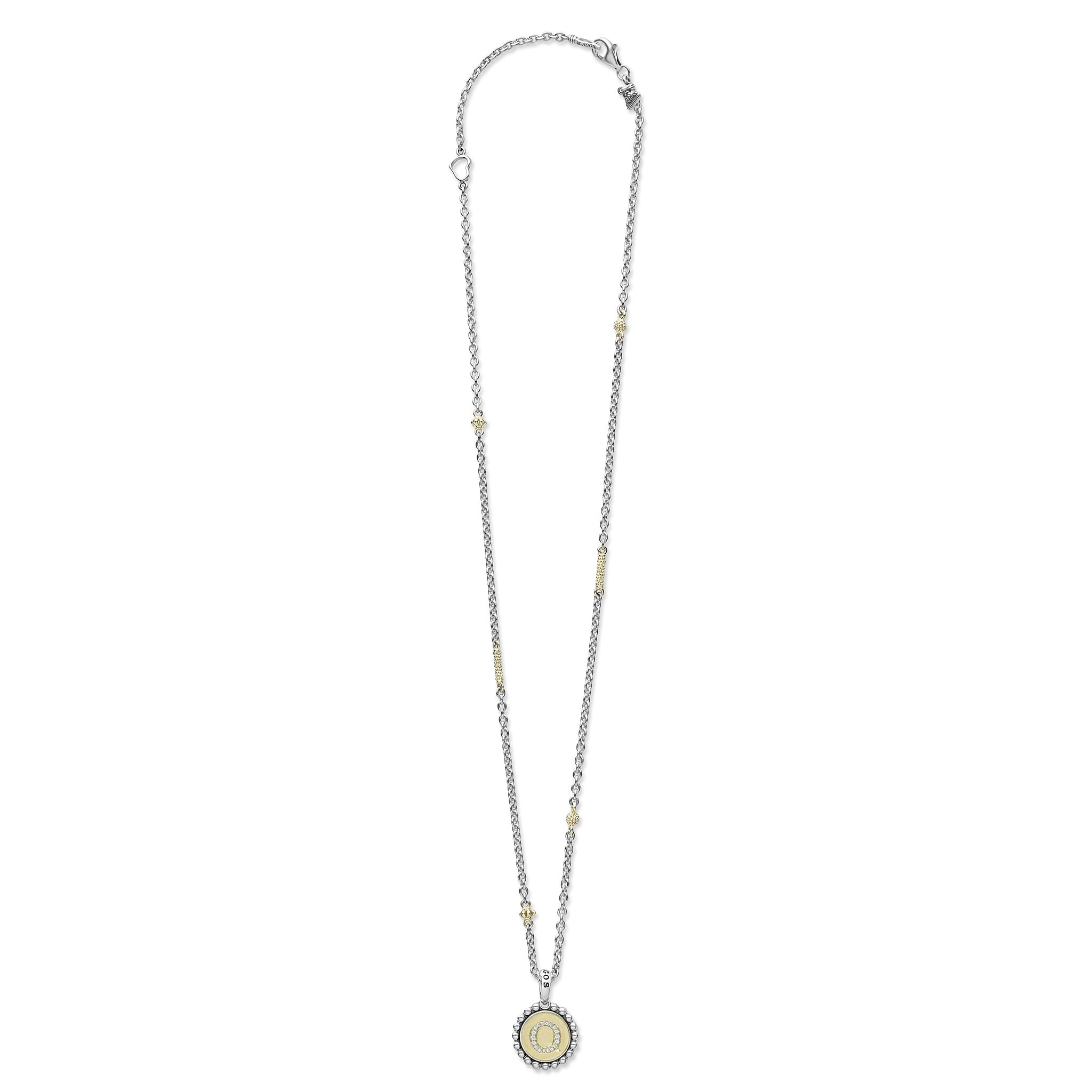 Signature Caviar Q Initial Diamond Charm Necklace features a sterling silver chain with 18K gold accents and a diamond-studded Q pendant, showcasing LAGOS's craftsmanship.