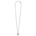 Signature Caviar Q Initial Diamond Charm Necklace features a sterling silver chain with 18K gold accents and a diamond-studded Q pendant, showcasing LAGOS's craftsmanship.