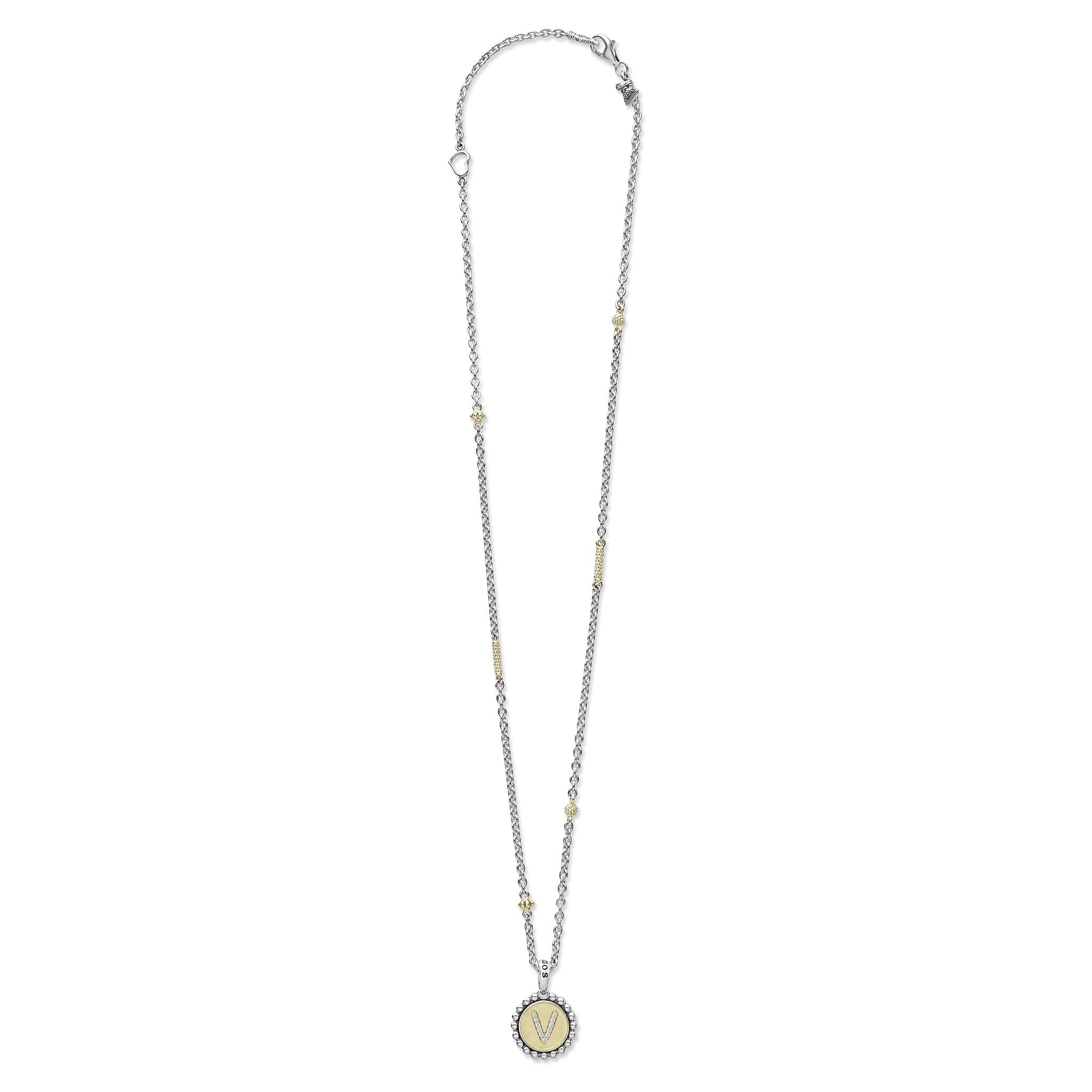 Signature Caviar V Initial Diamond Charm Necklace: sterling silver chain with 18K gold bead accents, V pavé stone pendant, showcasing LAGOS' elegant craftsmanship.