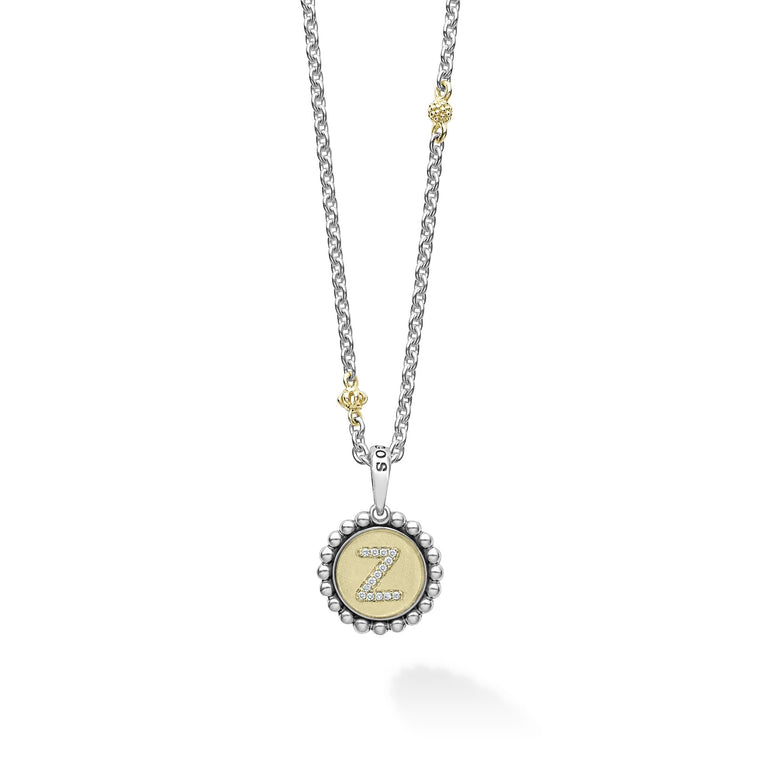 Our Signature Caviar sterling silver and 18K gold initial 'Z' diamond charm finished on a sterling silver and 18K gold Caviar beaded necklace.
