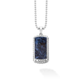 Pietersite accented by sterling silver Caviar beading forms this statement tag amulet featuring a Krunch emblem. Finished on a sterling silver ball chain necklace.