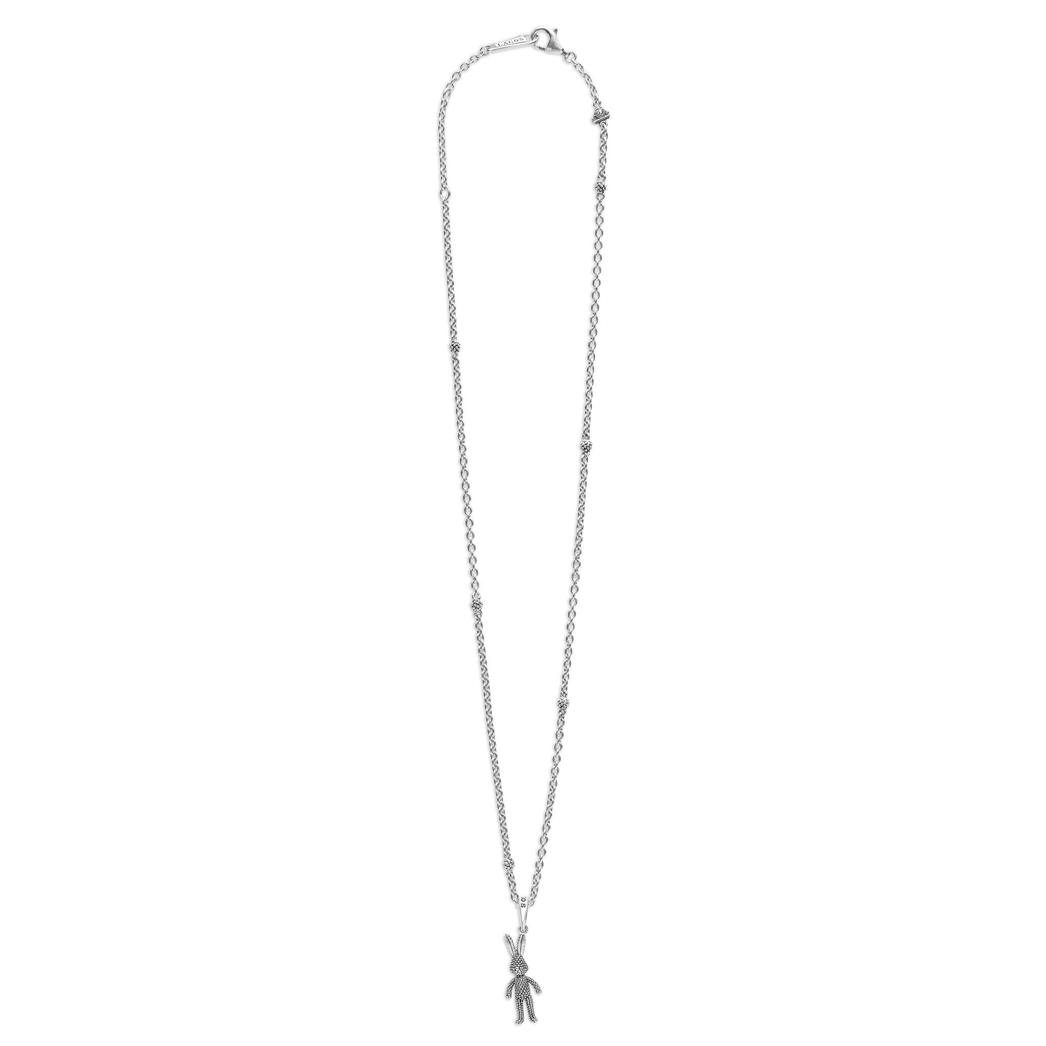 Rare Wonders Petite Silver Karat Pendant Necklace features a sterling silver chain with Caviar beading and a textured bunny charm, showcasing LAGOS' craftsmanship.