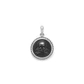 Onyx gemstone surrounded by sterling silver Caviar beading form this crossbone emblem amulet.