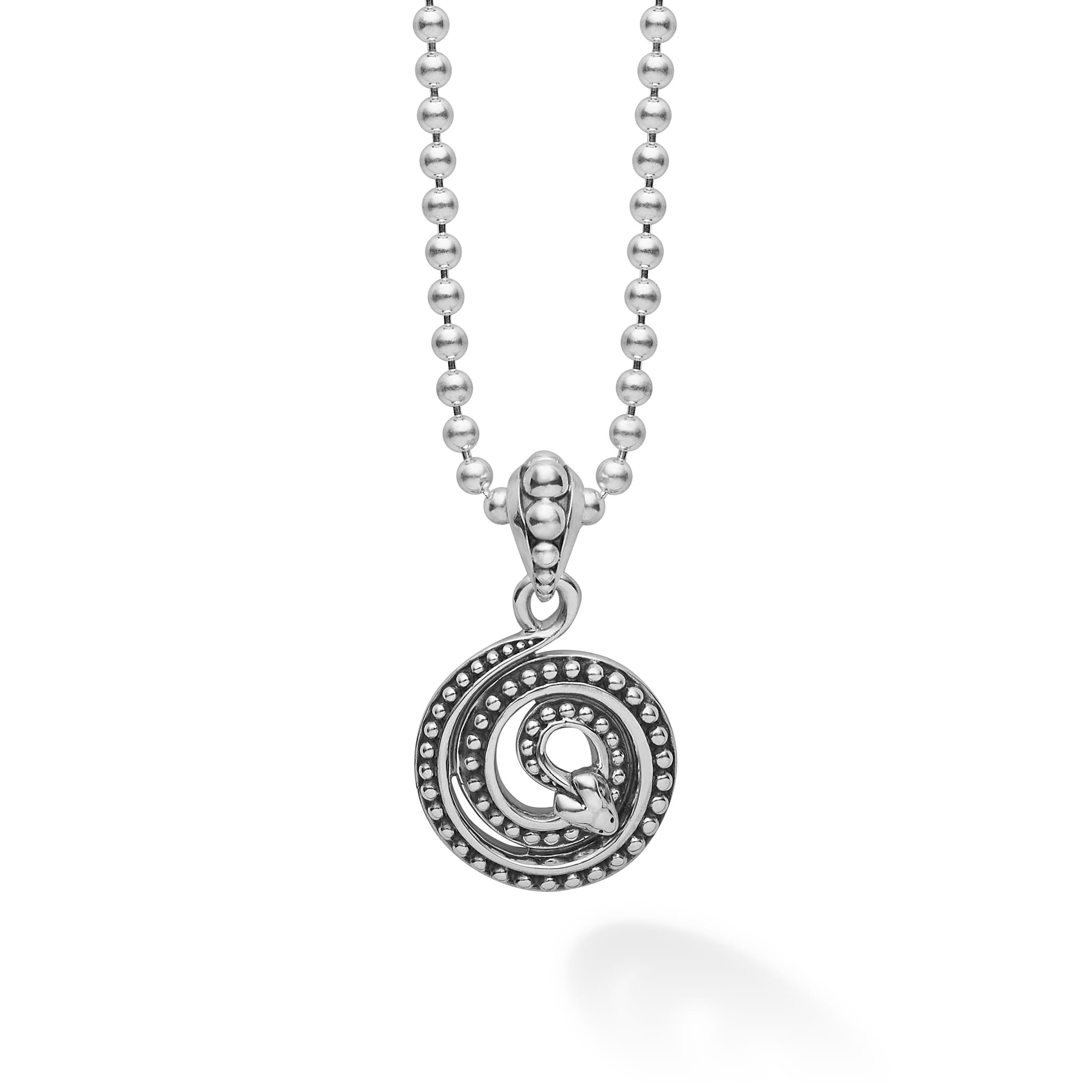 Sterling silver Caviar beading in a serpent motif form this coiled amulet. Finished on a sterling silver ball chain necklace.