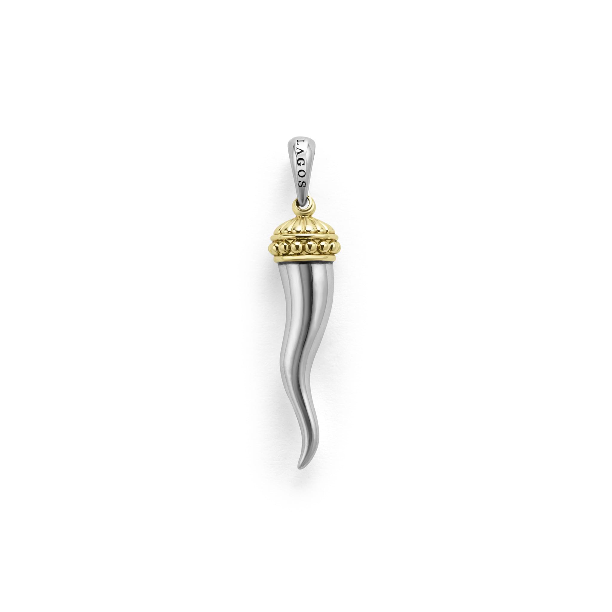 Meticulously crafted in 18K gold and sterling silver, this statement horn amulet is a symbol of strength and protection.