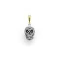 Artfully crafted skull amulet made of sterling silver Caviar beading accented by an 18K gold bale.
