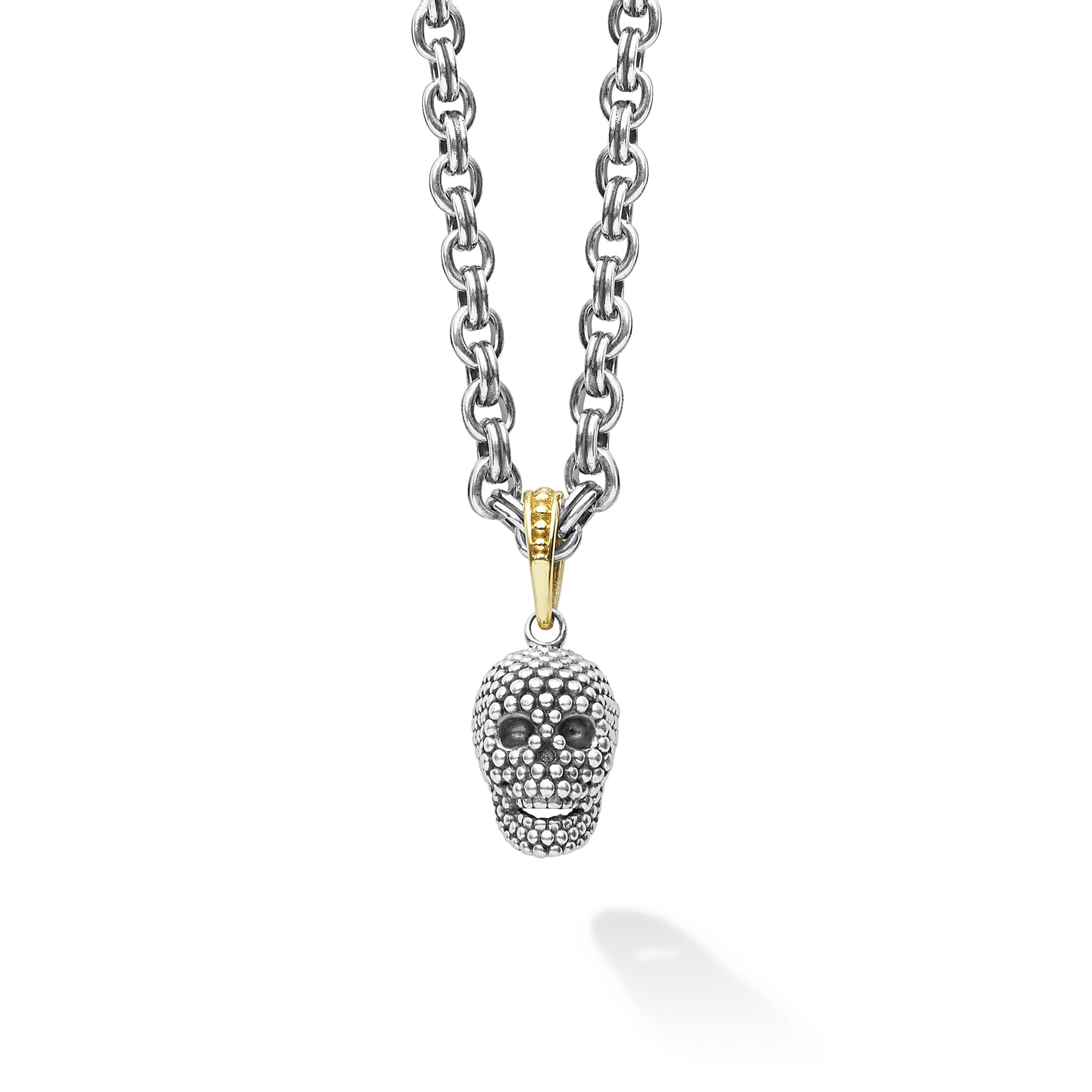 Artfully crafted skull amulet made of sterling silver Caviar beading. Finished on a 3mm double link chain necklace.