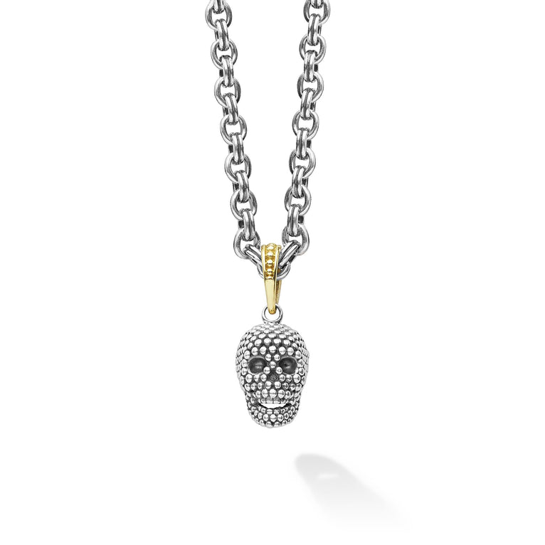 Artfully crafted skull amulet made of sterling silver Caviar beading. Finished on a 3mm double link chain necklace.