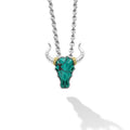 Intricately crafted turquoise gemstone and 18K gold bull motif pendant surrounded by sterling silver.