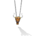 Intricately crafted tiger iron gemstone and 18K gold bull motif pendant surrounded by sterling silver.