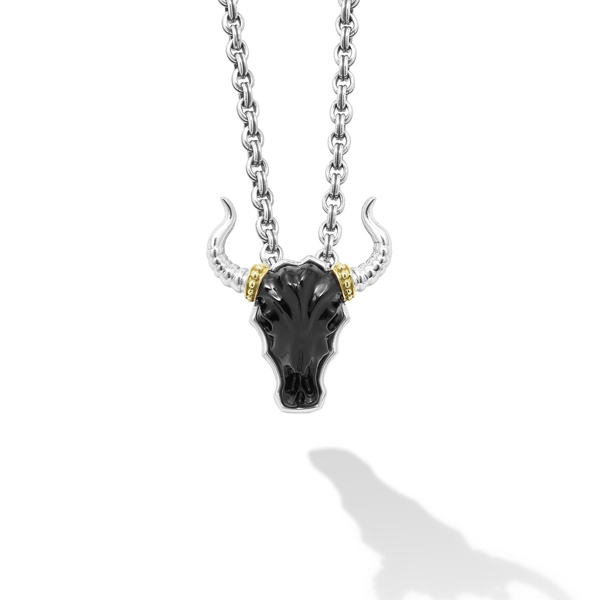Intricately crafted black agate gemstone and 18K gold bull motif pendant surrounded by sterling silver.