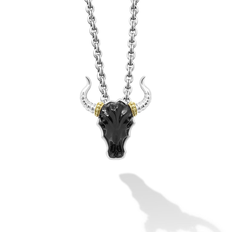 Intricately crafted black agate gemstone and 18K gold bull motif pendant surrounded by sterling silver.